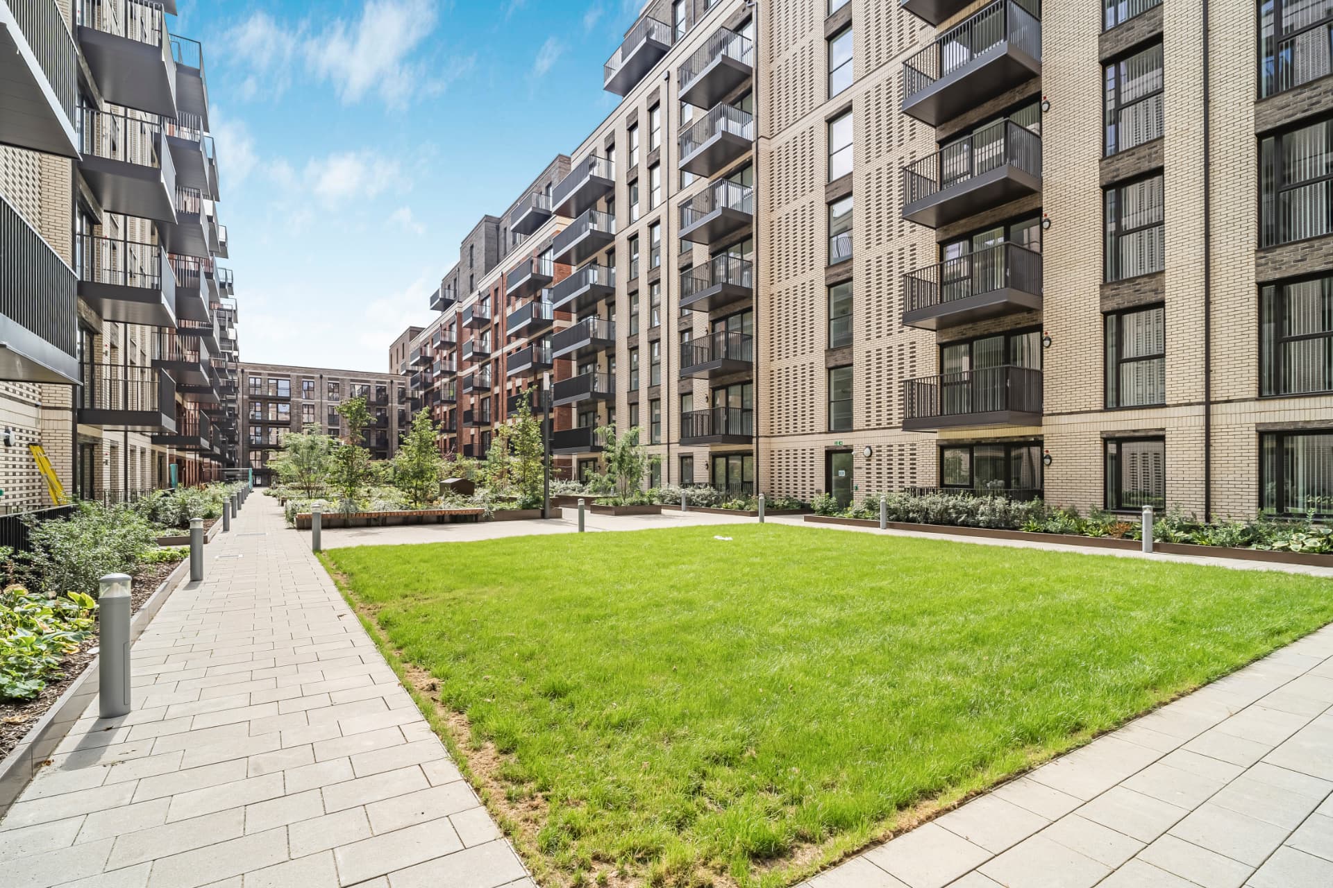 Landscaped courtyard between new residential buildings at Clapham Park
